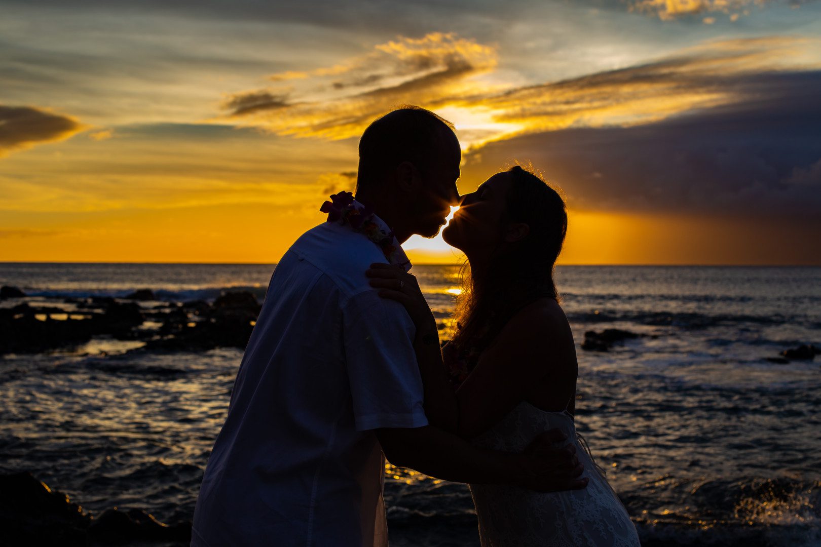 A Couple Enjoy The Romantic Evening Near The Sea