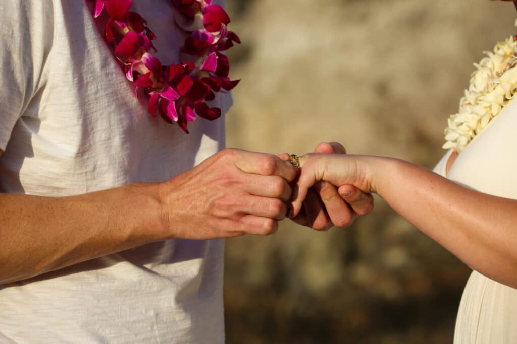 Couple getting their wedding bands