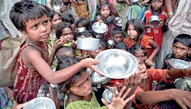 Children in a group asking for water from a well