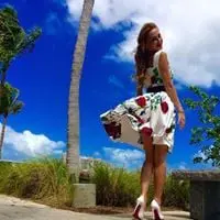 Woman wearing a flowery dress for her wedding in Maui