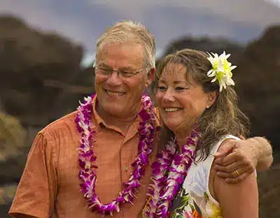 Husband and wife getting maui'd on a beach in Maui