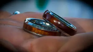 Close up of a wood wedding ring for a husband and wife