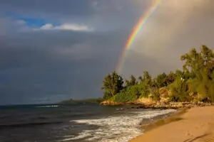 Rainbow can be seen from a beach in Maui after a rain storm