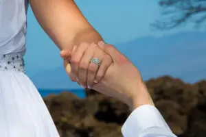 Couple holding hands at their wedding ceremony